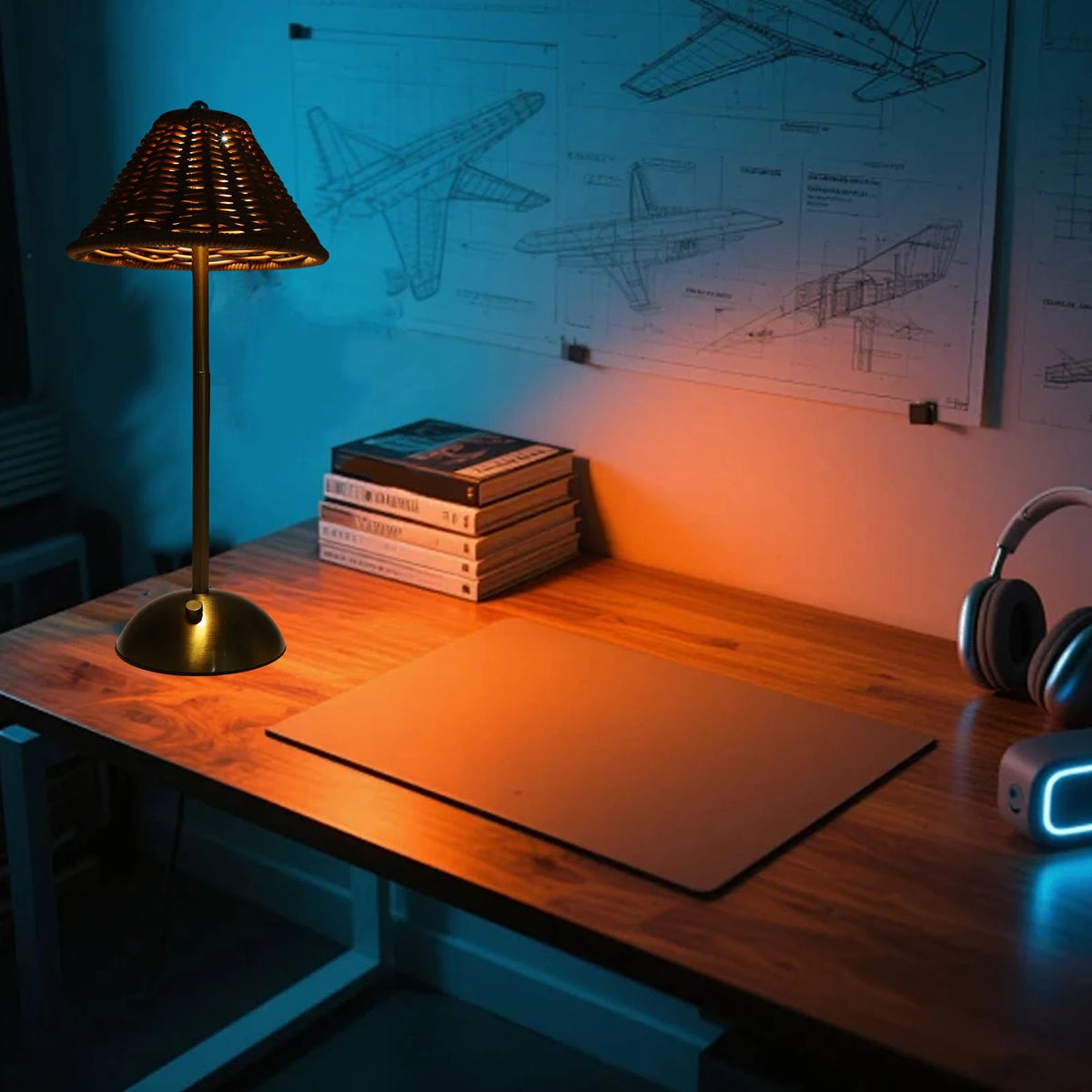 Gold Riva woven cordless lamp glowing on a desk