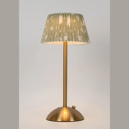 Elara lamp with a cream floral pleated shade on a neutral backdrop