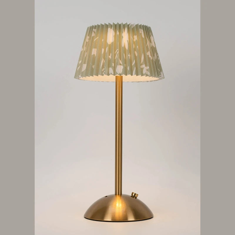 Elara lamp with a cream floral pleated shade on a neutral backdrop