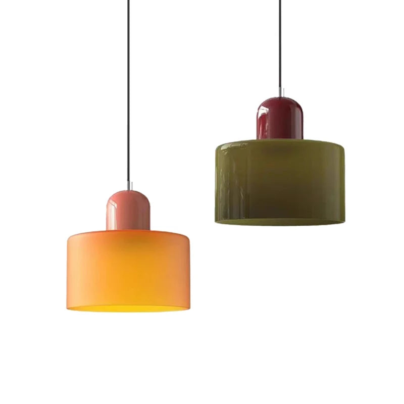 Orange and green Mira colored glass pendants shown on white