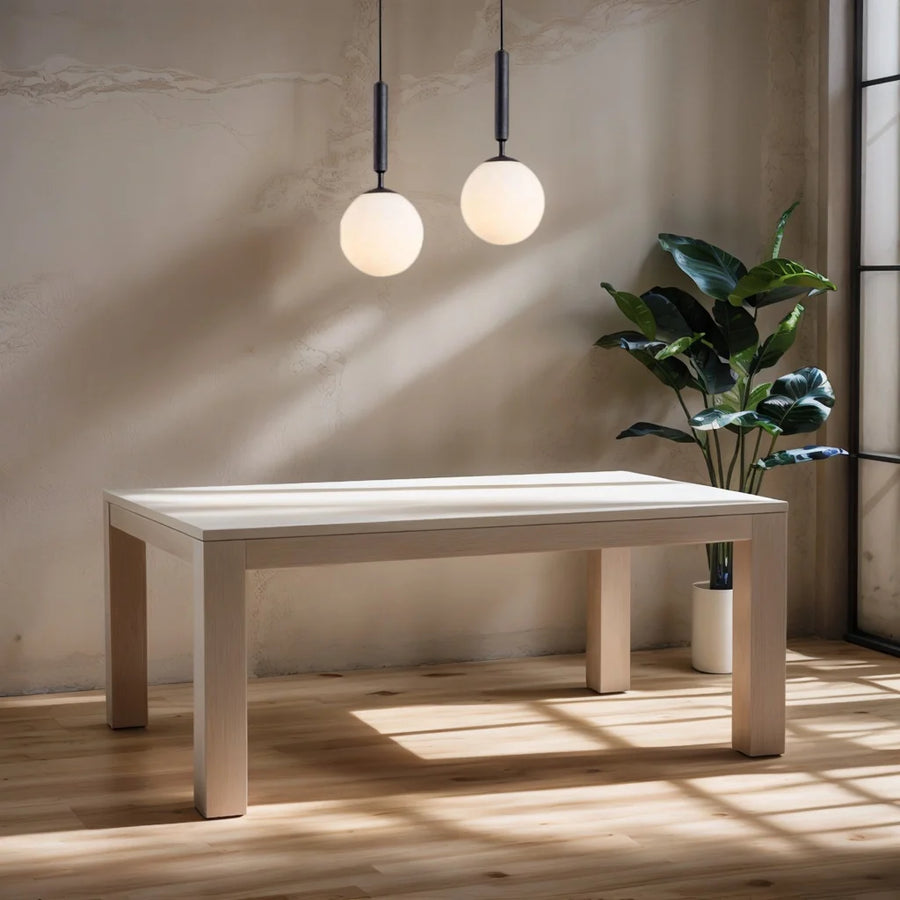 Pair of Lune opal globe pendants above a pale wood bench