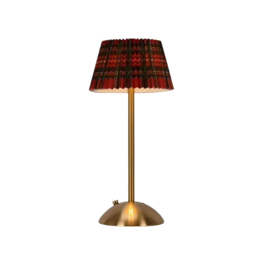 Elara cordless lamp with a red tartan pleated shade on white