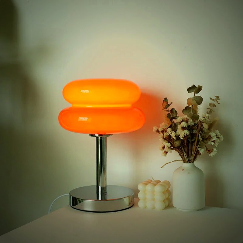 Ambra glass dome lamp lit in amber, part of The Amber Pair