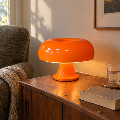 Orange Oslo mushroom lamp in a lived-in reading corner