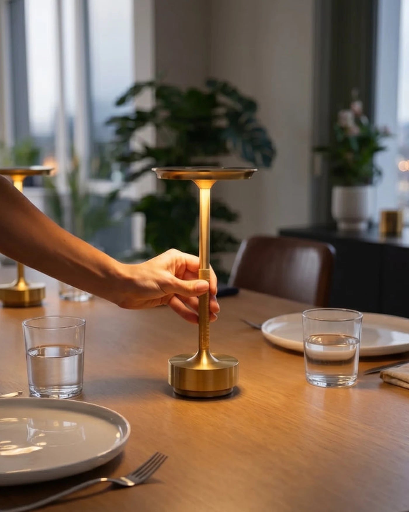 Astor cordless table lamp being placed on a dining table